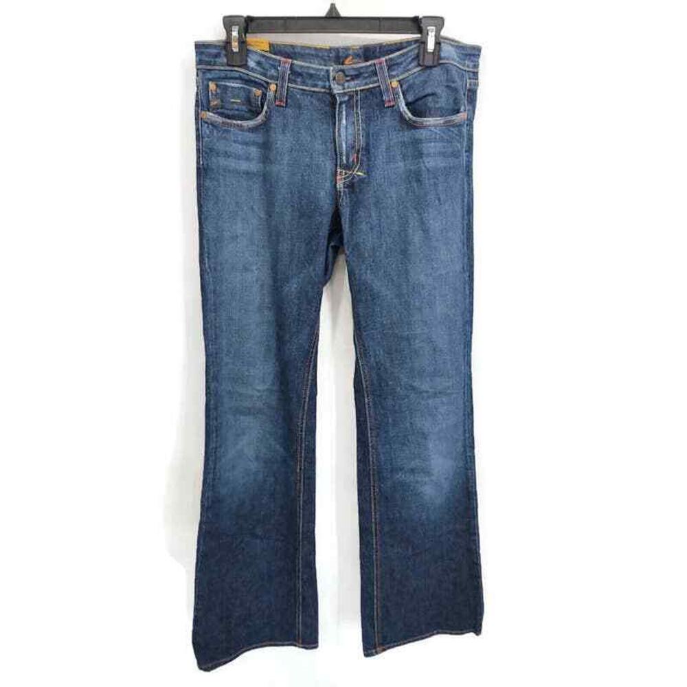 Lo Fli medium wash Low Rise boot cut jeans in size 31 Long.